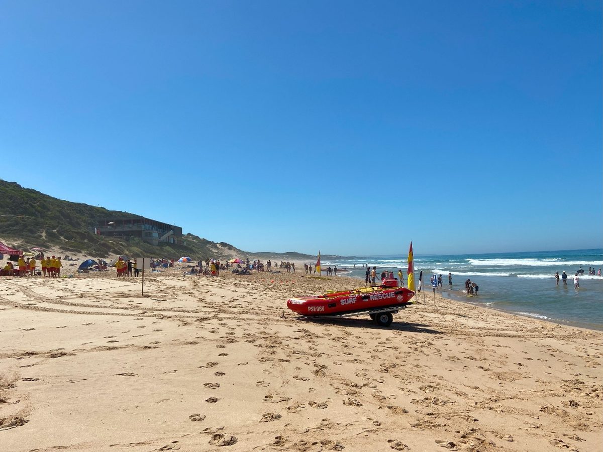Patrolled beach at Portsea with a Life Saving Victoria rescue boat on the sand